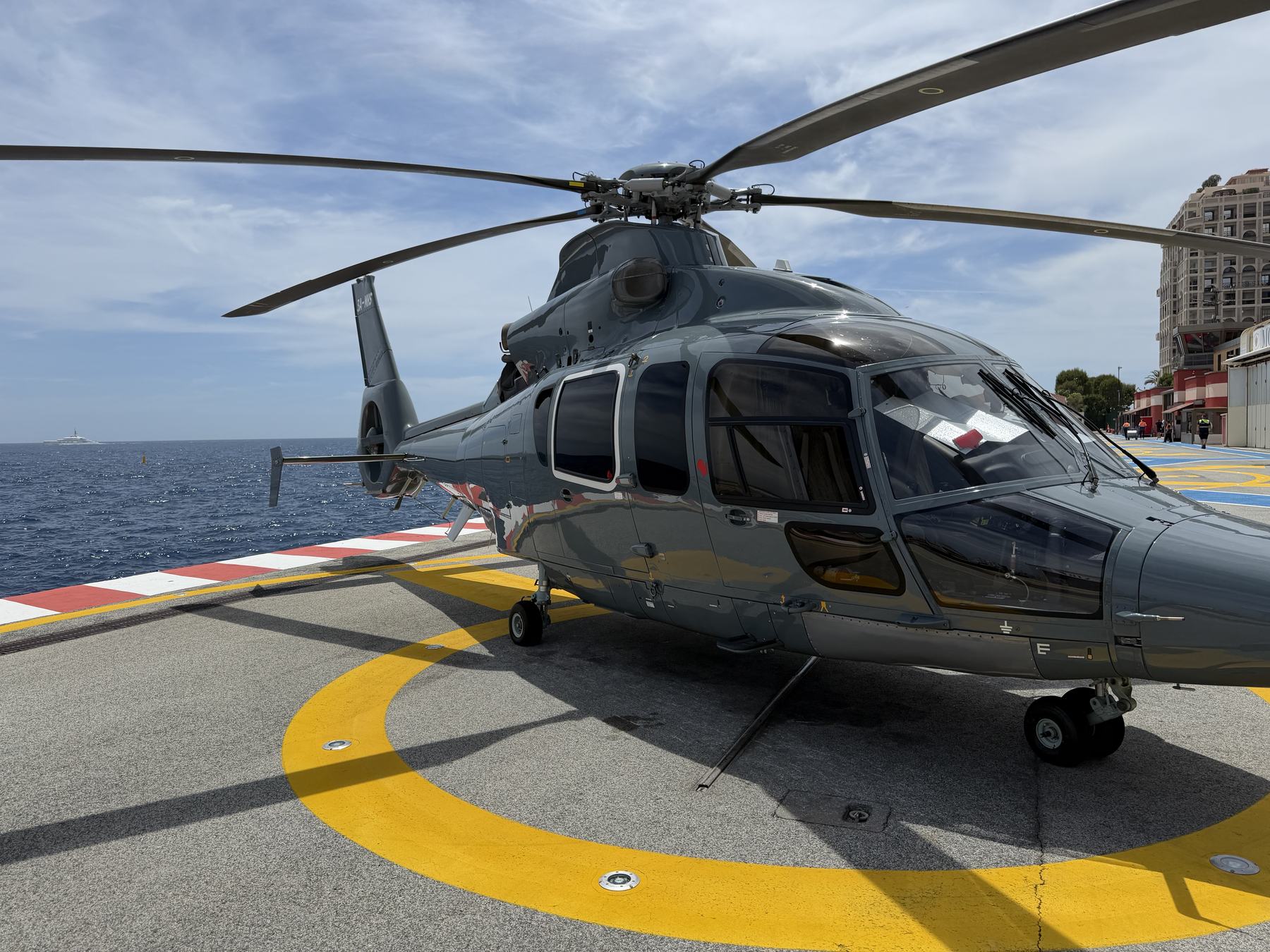 The helicopter on the Monaco helipad, the Mediterranean beyond